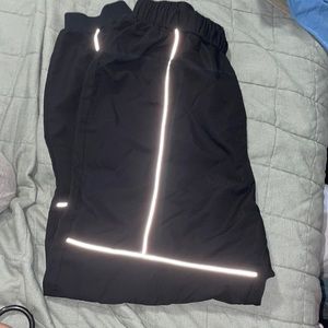 SHEIN size medium pants that glow whne flash is used or in dark